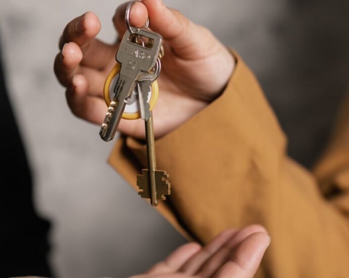 House keys handed over representing non-resident and expat mortgages for UK luxury property