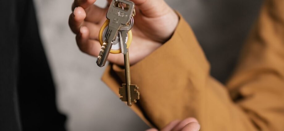 House keys handed over representing non-resident and expat mortgages for UK luxury property