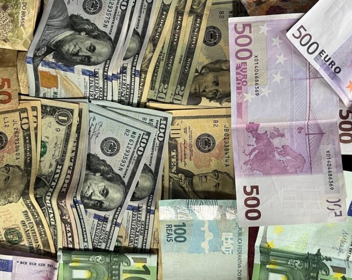 International banknotes representing currency transfer for buying UK luxury property from abroad