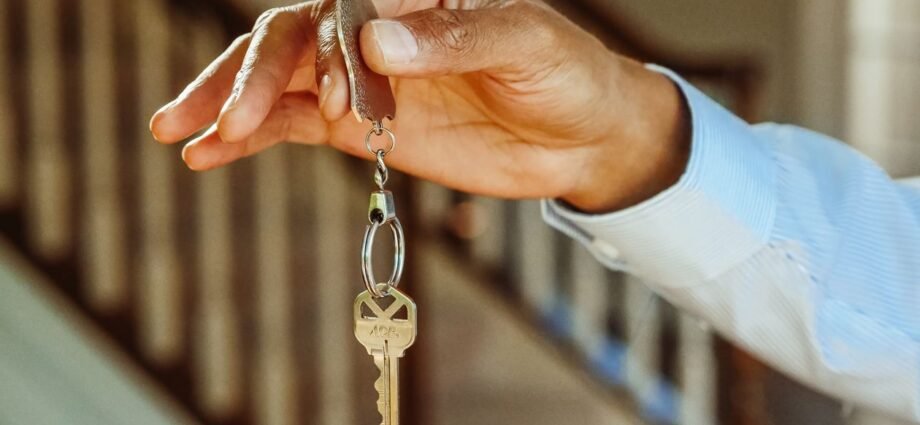 House key on a keychain representing the process of selling UK property as a non-resident