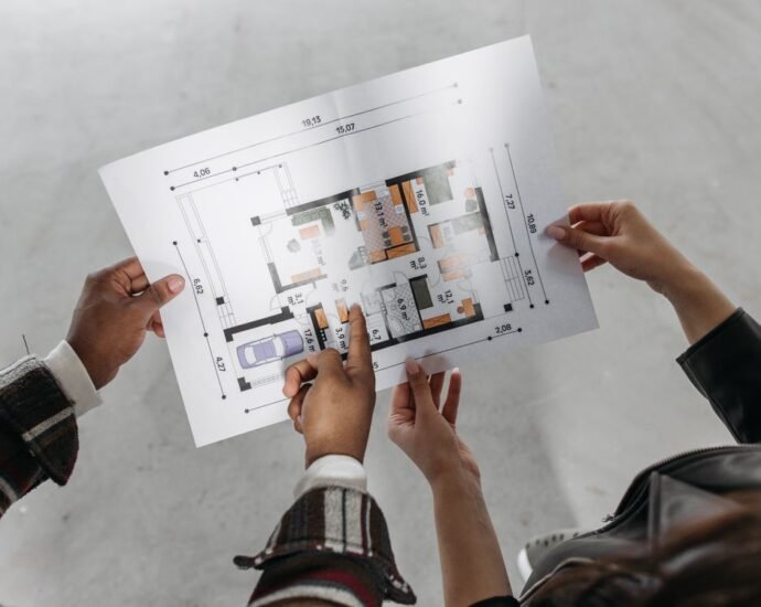Reviewing property plans representing survey types for high-value UK property buyers