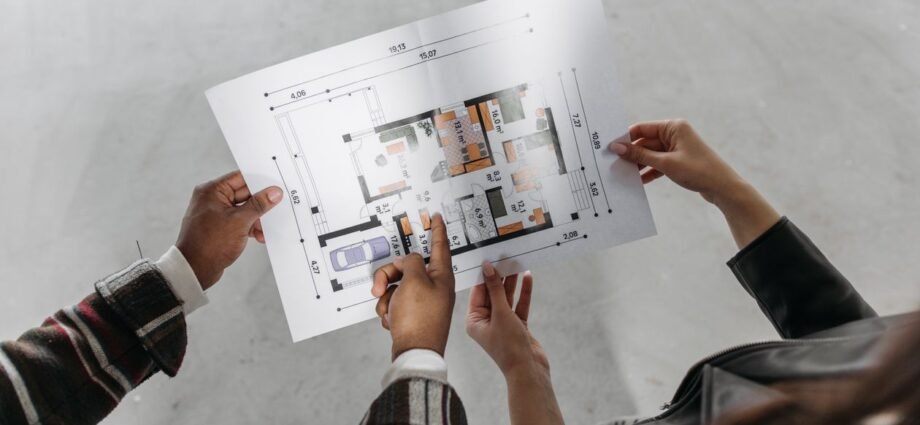 Reviewing property plans representing survey types for high-value UK property buyers